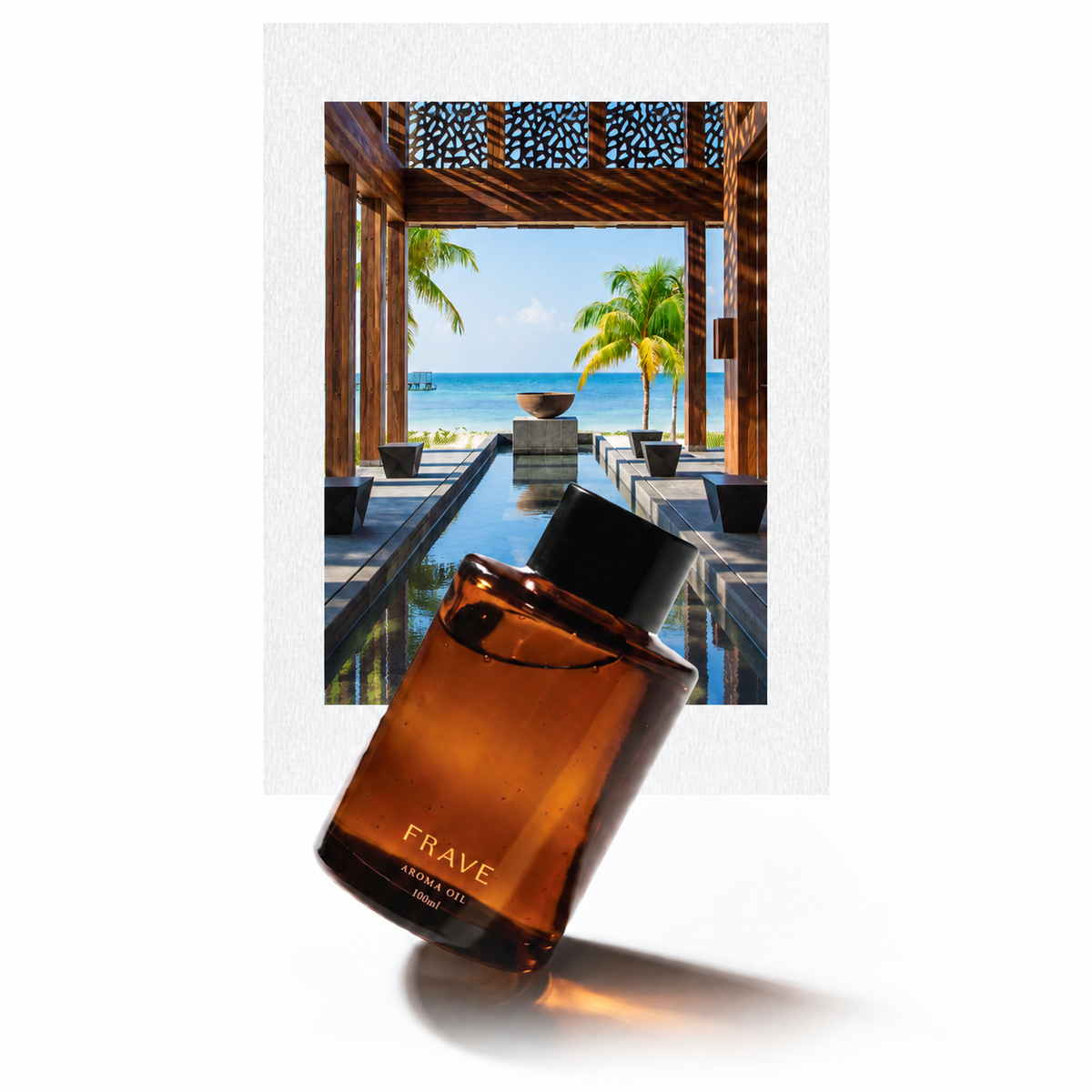 The Nizuc FRAVE aroma oil bottle with daytime resort photo panel