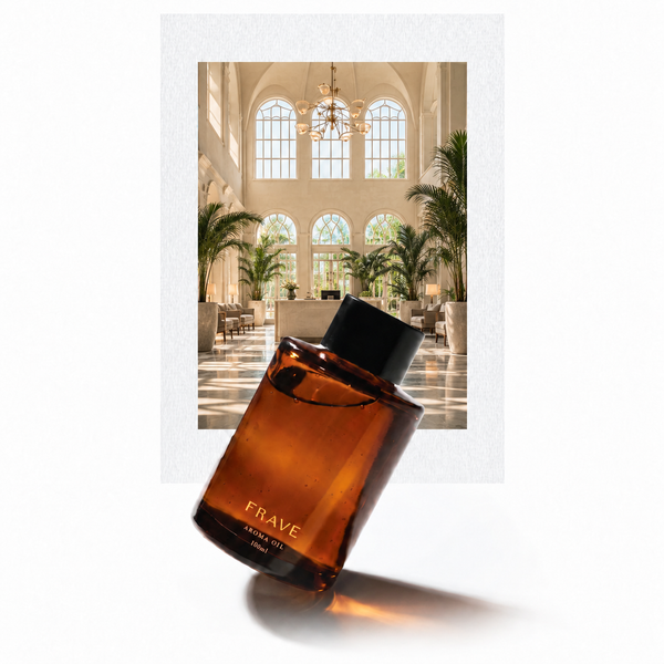Additional Hotel aroma oil — FRAVE amber bottle with a sunlit boutique hotel inspiration photo